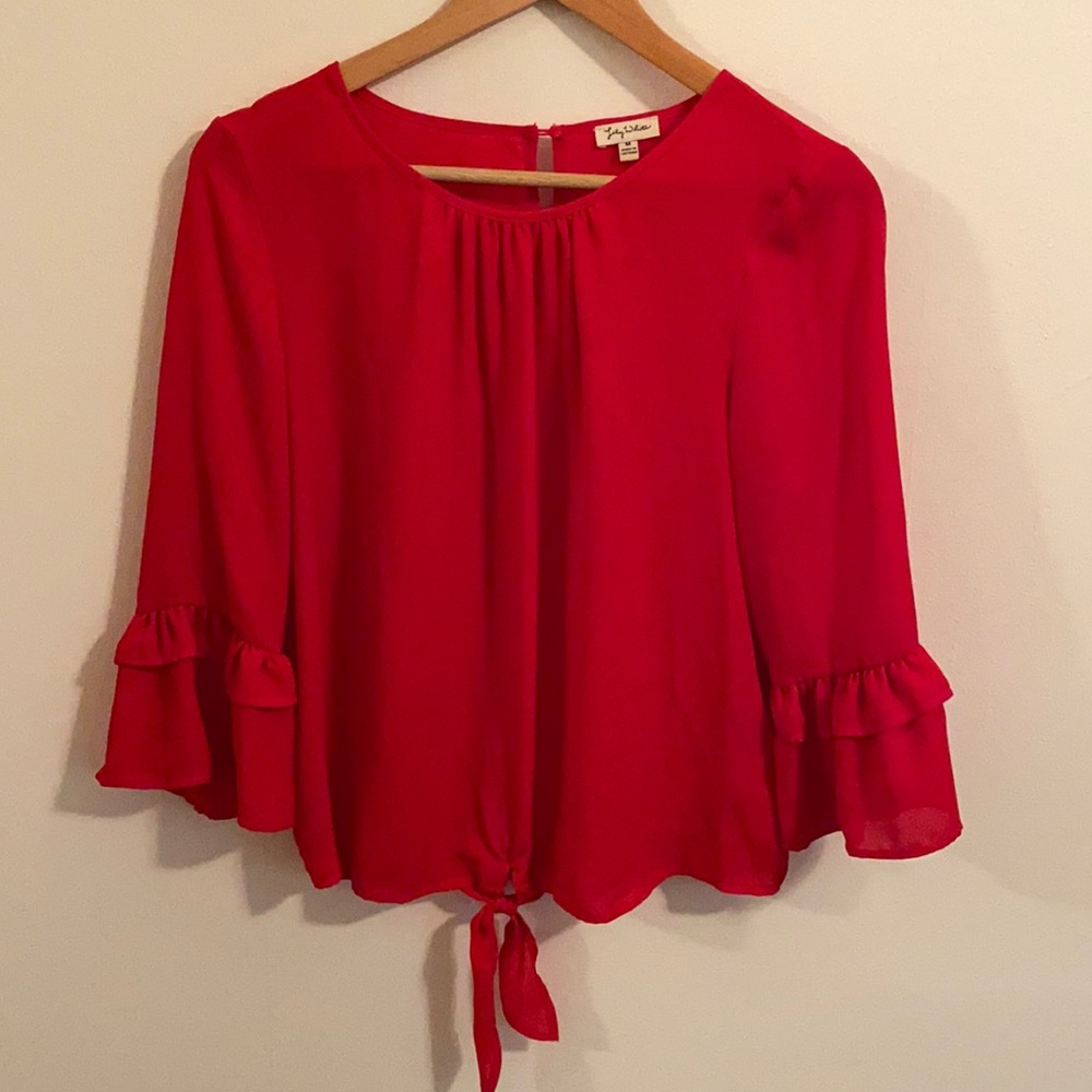 Red blouse with tie and layered ruffles sleeves